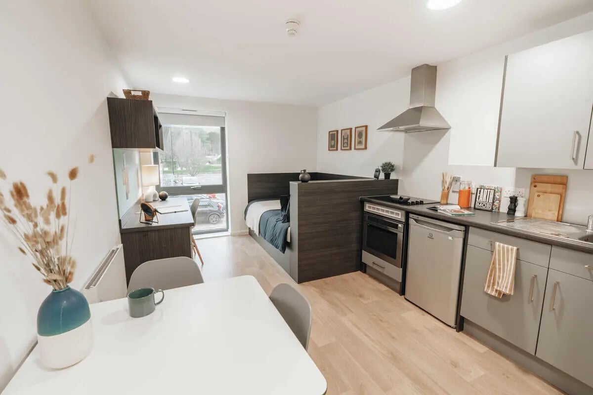 Bed desk kitchen area dining area studio at Avon Studios in Bath Student Accommodation