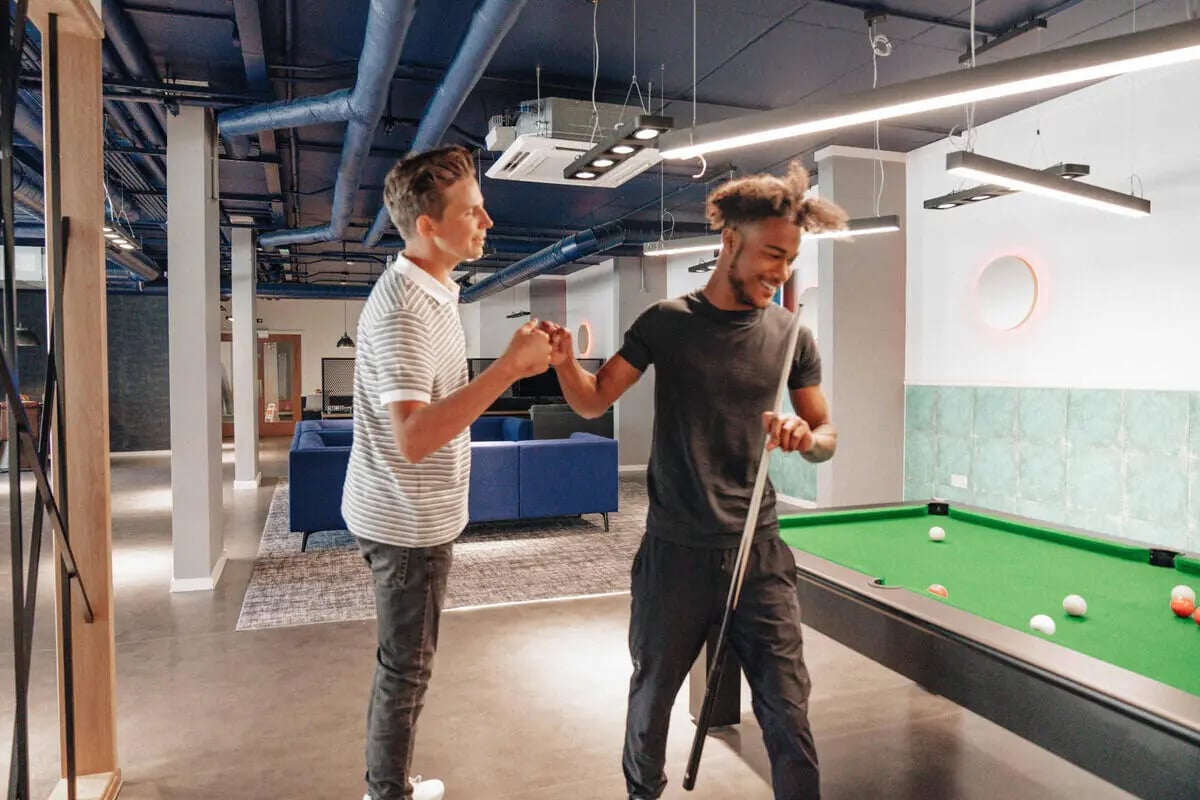 Two students playing pool room playing area at Alma Court in Canterbury Student Accommodation