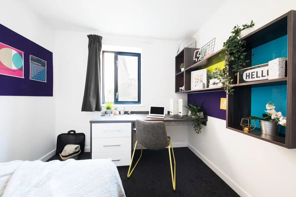 Desk chair laptop shelves with plants and decorations bedroom at Prospect Point in Liverpool Student Accommodation