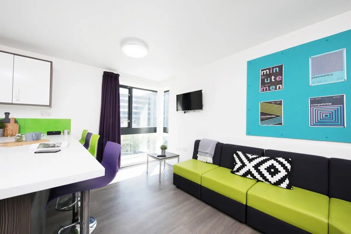 Modern kitchen with counter and living room living room at Prospect Point in Liverpool Student Accommodation