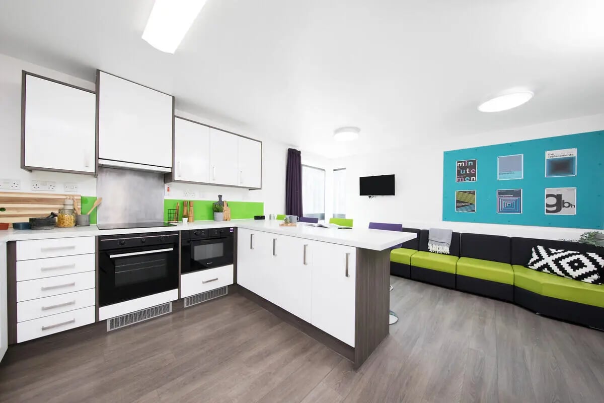 Modern kitchen with island and lounge area living room at Prospect Point in Liverpool Student Accommodation