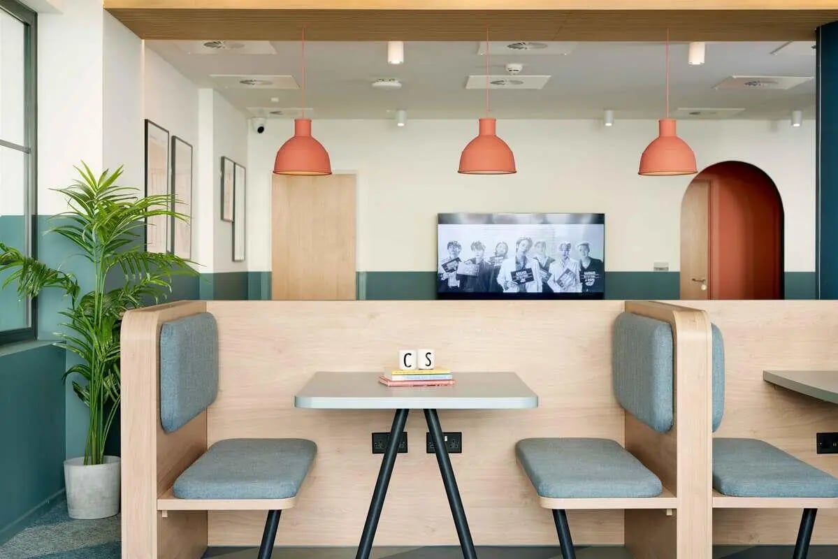 Booth seating tables and plant study area at St Teresa House in Plymouth Student Accommodation