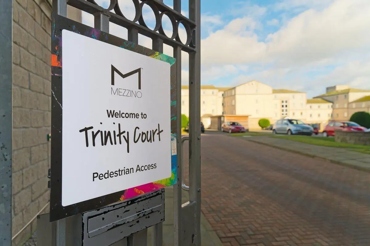 Sign welcomes to Trinity Court exterior at Trinity Court in Aberdeen Student Accommodation