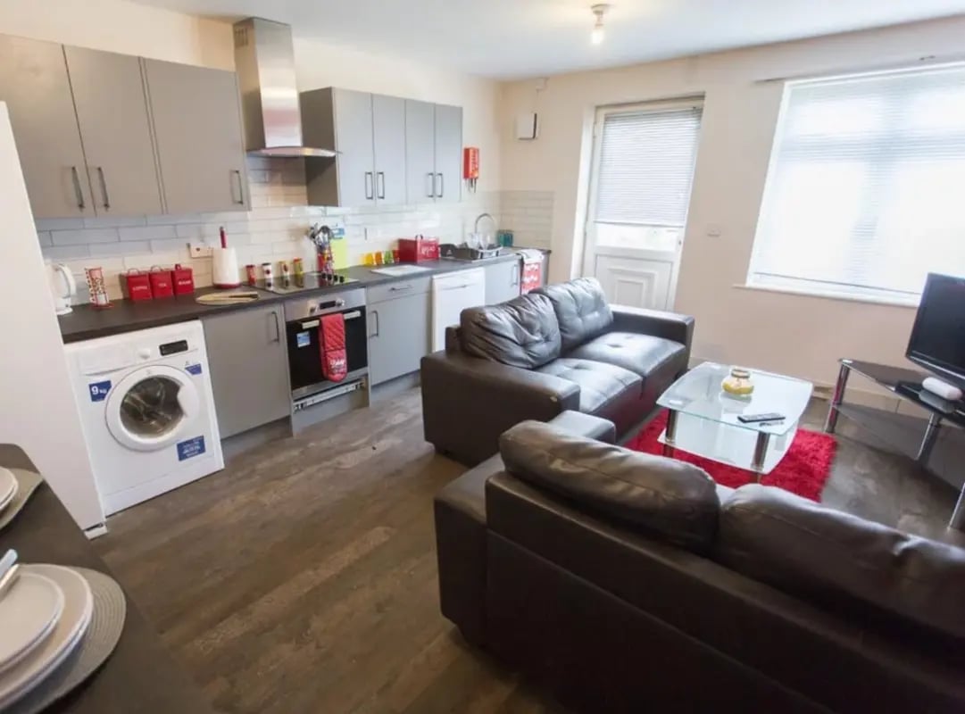 Kitchen washing machine couches coffee table living room at Radmoor House in Loughborough Student Accommodation