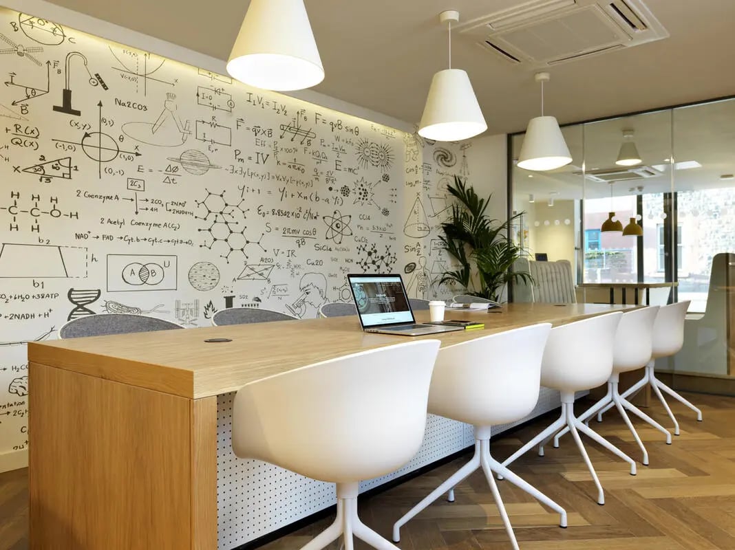 Study area with whiteboard walls and table chairs. at Student Castle Edinburgh in Edinburgh Student Accommodation