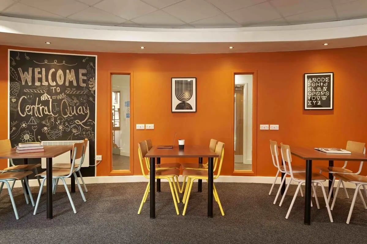 Tables chairs chalkboard welcome art communal area at Central Quay in Sheffield Student Accommodation