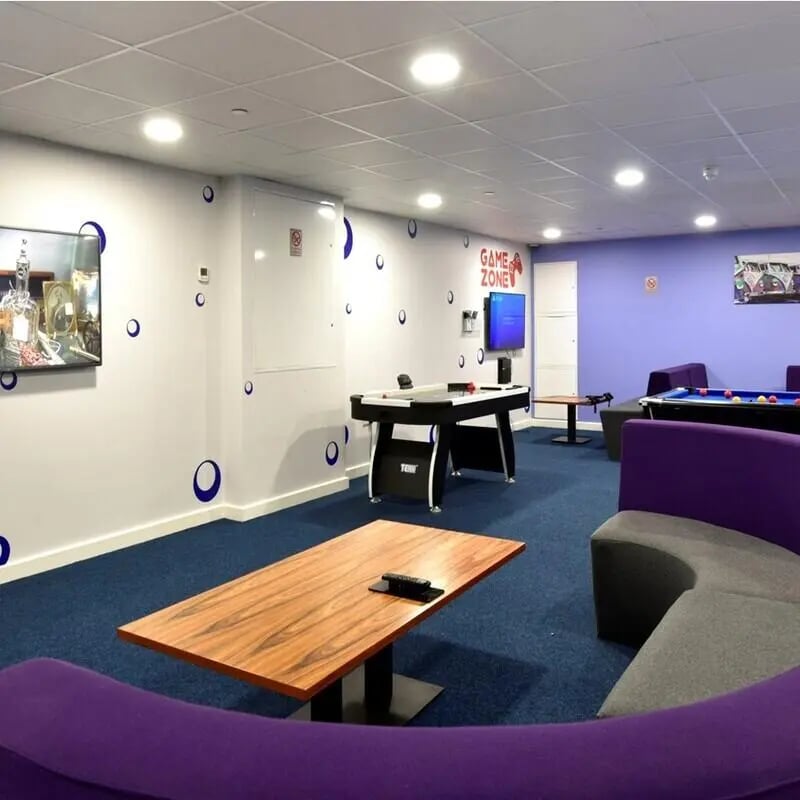 Air hockey table pool table lounge living area at The Courtyard Block B in Huddersfield Student Accommodation