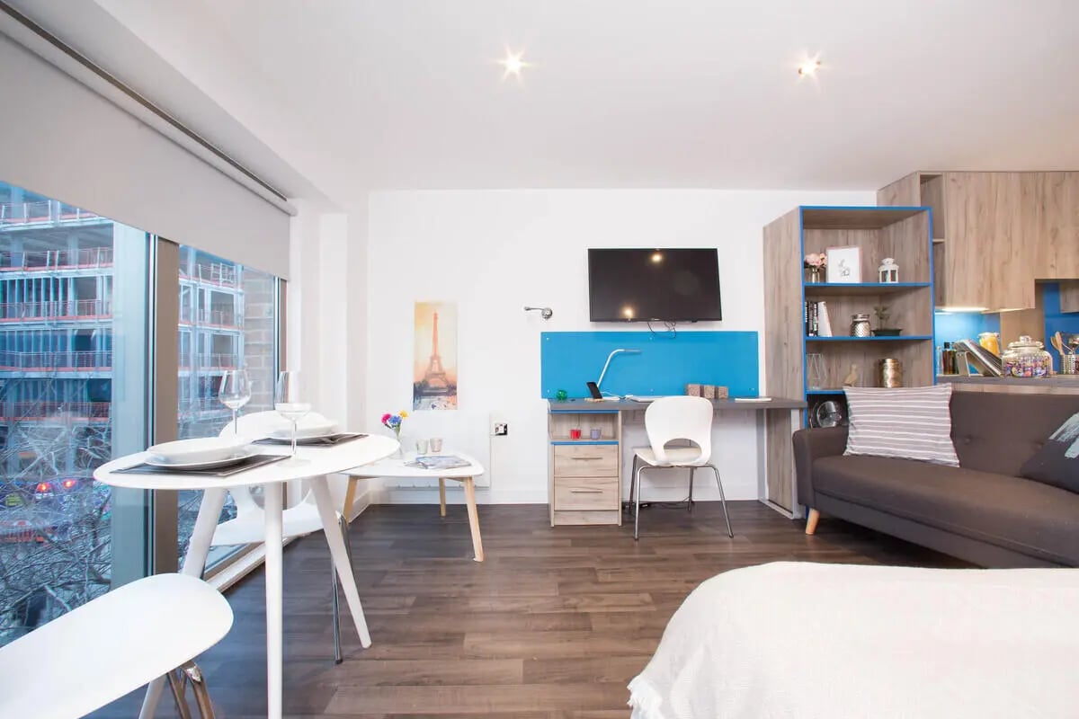 Dining table desk sofa shelving studio apartment at Northgate Point in Chester Student Accommodation