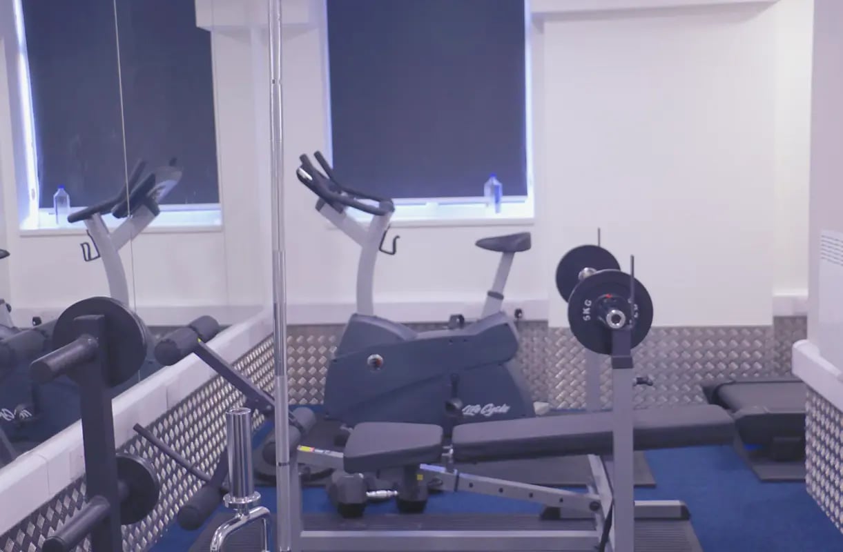Exercise bikes and weight bench gym area at Renaissance House in Leicester Student Accommodation