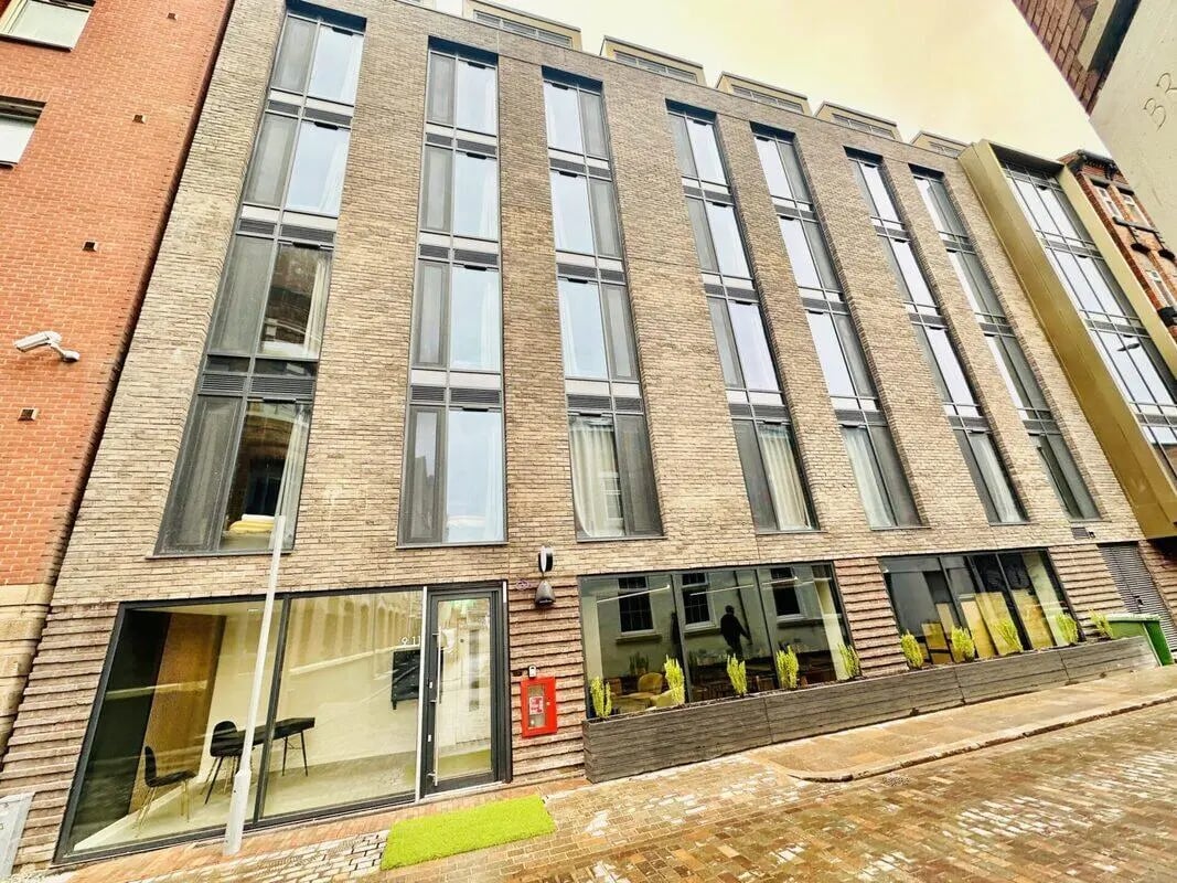 Brick building with many windows exterior at The Nest Leicester in Leicester Student Accommodation