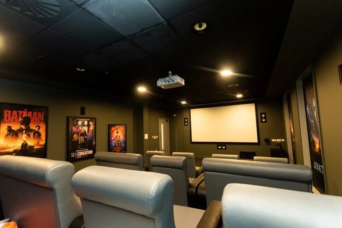 Comfortable cinema seats movie posters projector screen cinema at Albany Student Village in Coventry Student Accommodation