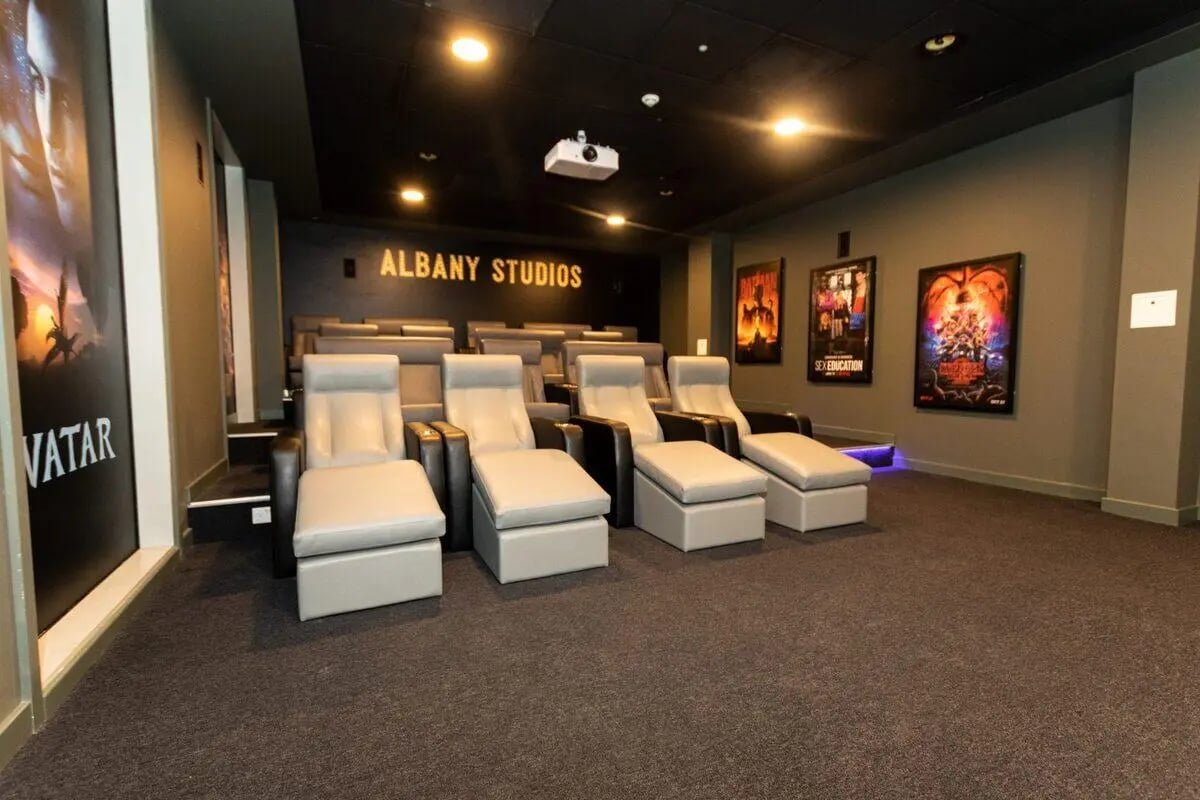 Recliner chairs movie posters projector Albany Studios cinema at Albany Student Village in Coventry Student Accommodation