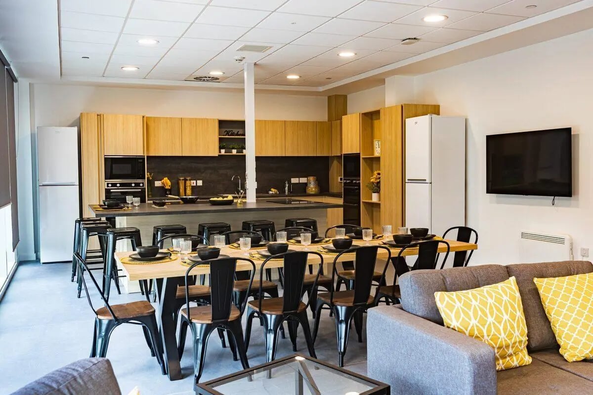 Kitchen with island dining table and sofa. at Albany Student Village in Coventry Student Accommodation
