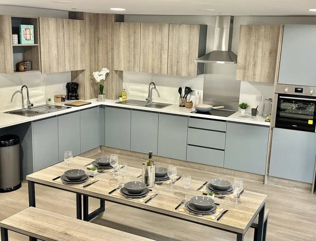 L-shaped kitchen with dining table kitchen at Albany Student Village in Coventry Student Accommodation