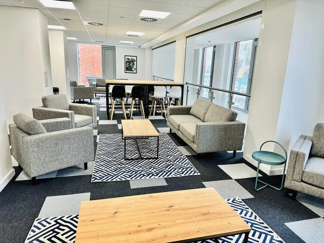 Sofas chairs tables and bar stools communal area at Albany Student Village in Coventry Student Accommodation