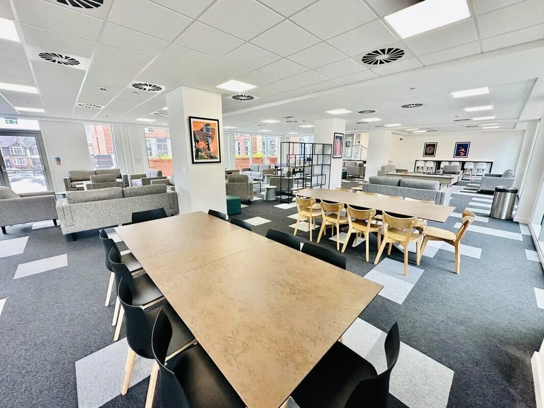 Dining tables sofas and chairs common area at Albany Student Village in Coventry Student Accommodation