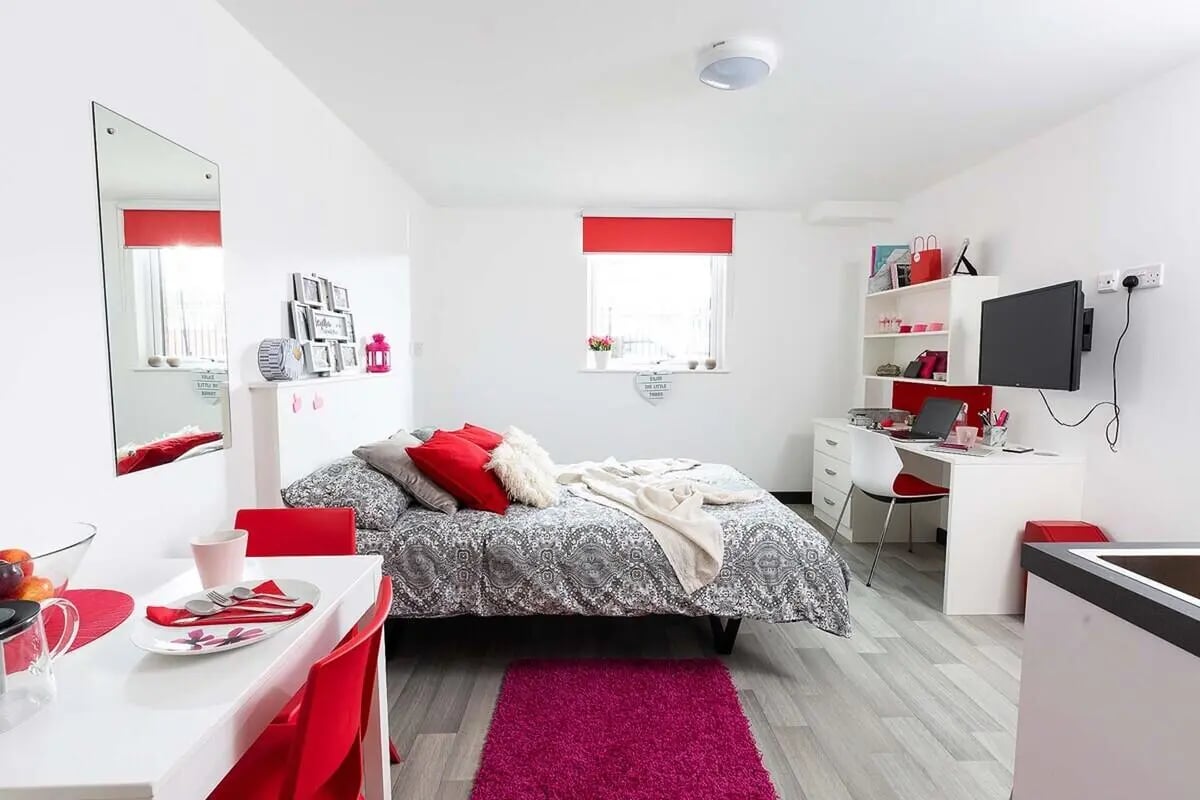 Bed desk mirror and dining area bedroom at Julian Court in Coventry Student Accommodation