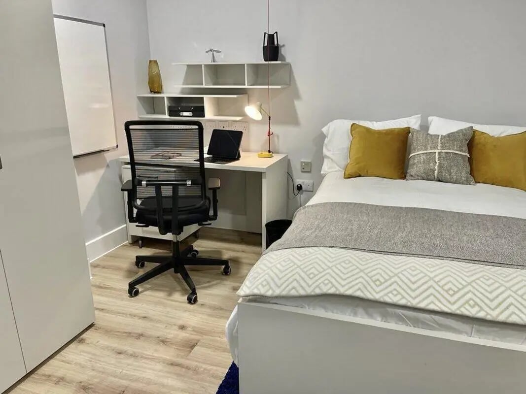 Desk chair laptop bed pillows study area bedroom at Hydrogen Falmouth in Falmouth Student Accommodation