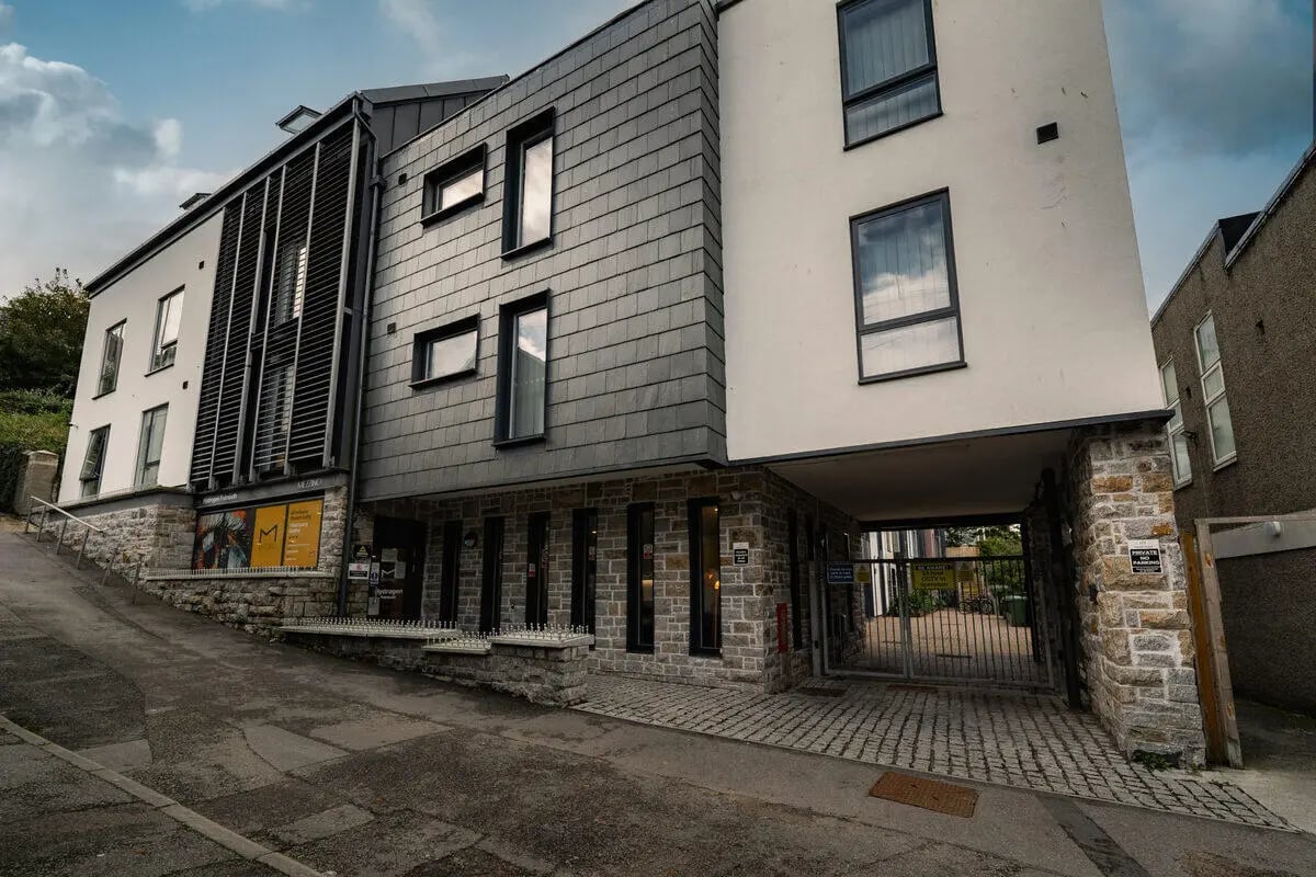 Modern building entrance with stone and slate exterior exterior at Hydrogen Falmouth in Falmouth Student Accommodation