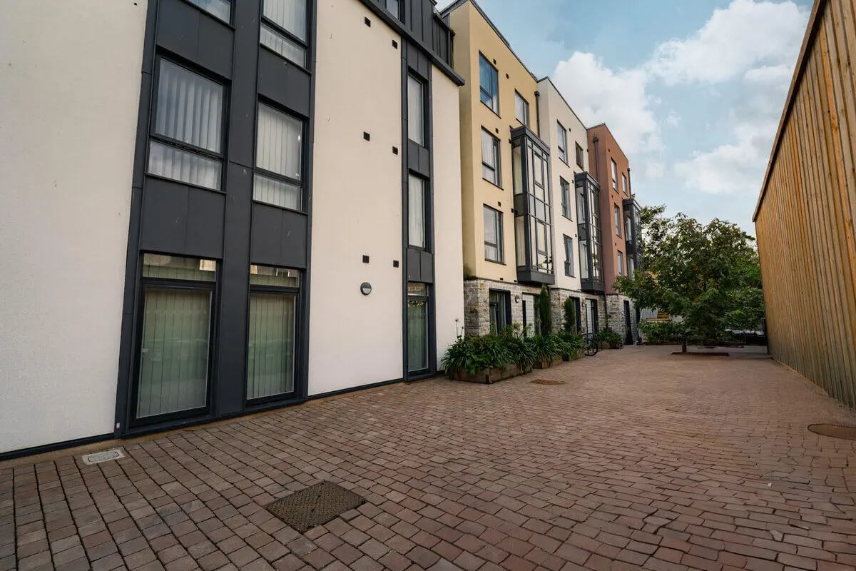 Modern buildings with windows brick courtyard exterior at Hydrogen Falmouth in Falmouth Student Accommodation