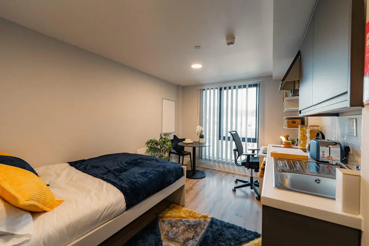 Bed study table chair kitchen counter studio apartment at Hydrogen Falmouth in Falmouth Student Accommodation
