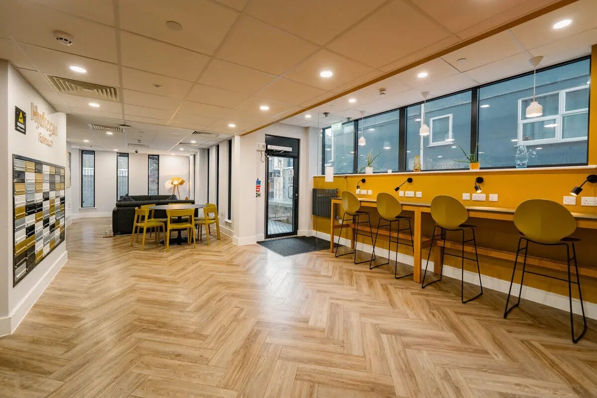 Communal area with seating study tables and seating at Hydrogen Falmouth in Falmouth Student Accommodation