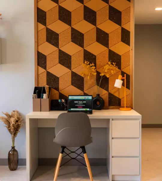 Desk with laptop lamp vase and chair study area at The Walls in Southampton Student Accommodation