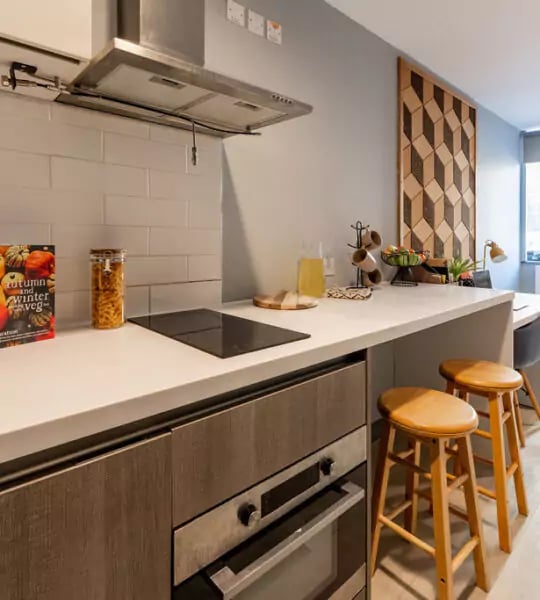 Modern kitchen with oven stools and counter space kitchen at The Walls in Southampton Student Accommodation