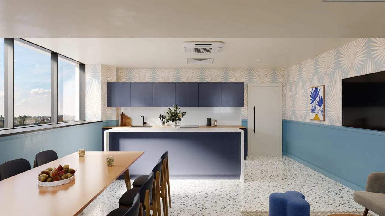 Modern kitchen island with bar stools dining table living room at B16 Studios in Birmingham Student Accommodation