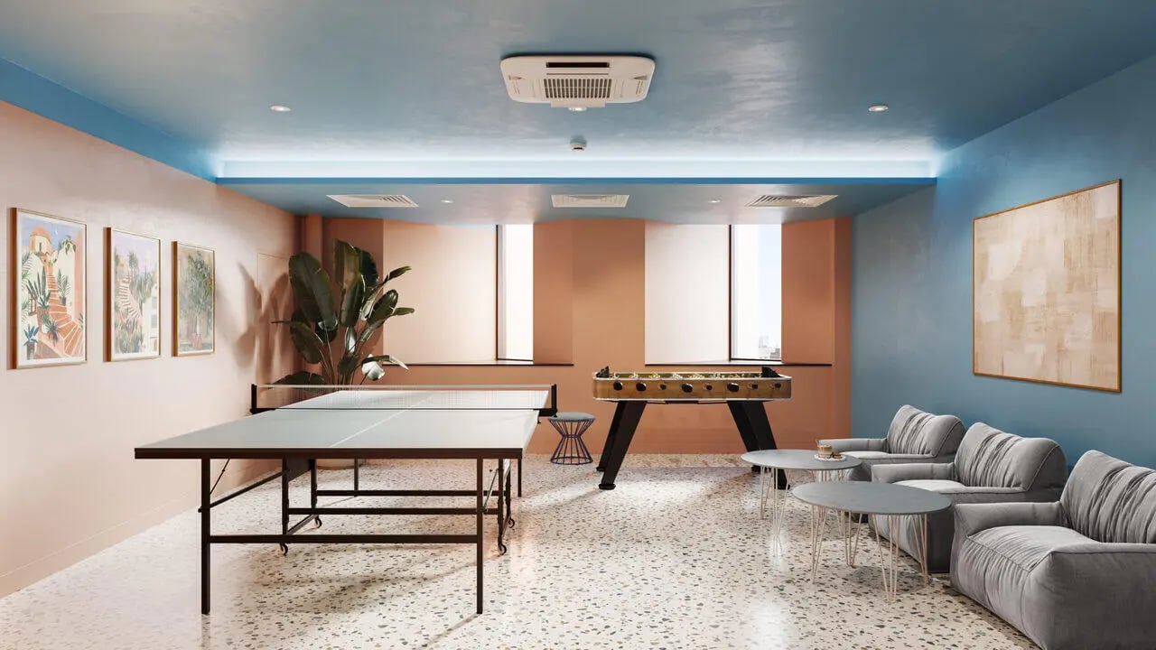 Ping pong table foosball table sofas artwork common room at B16 Studios in Birmingham Student Accommodation
