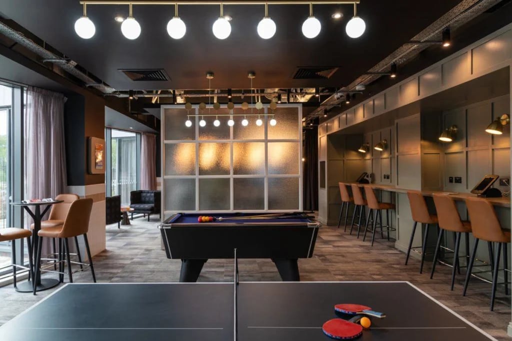 Ping pong table pool table bar lounge area communal space at West Village in Glasgow Student Accommodation