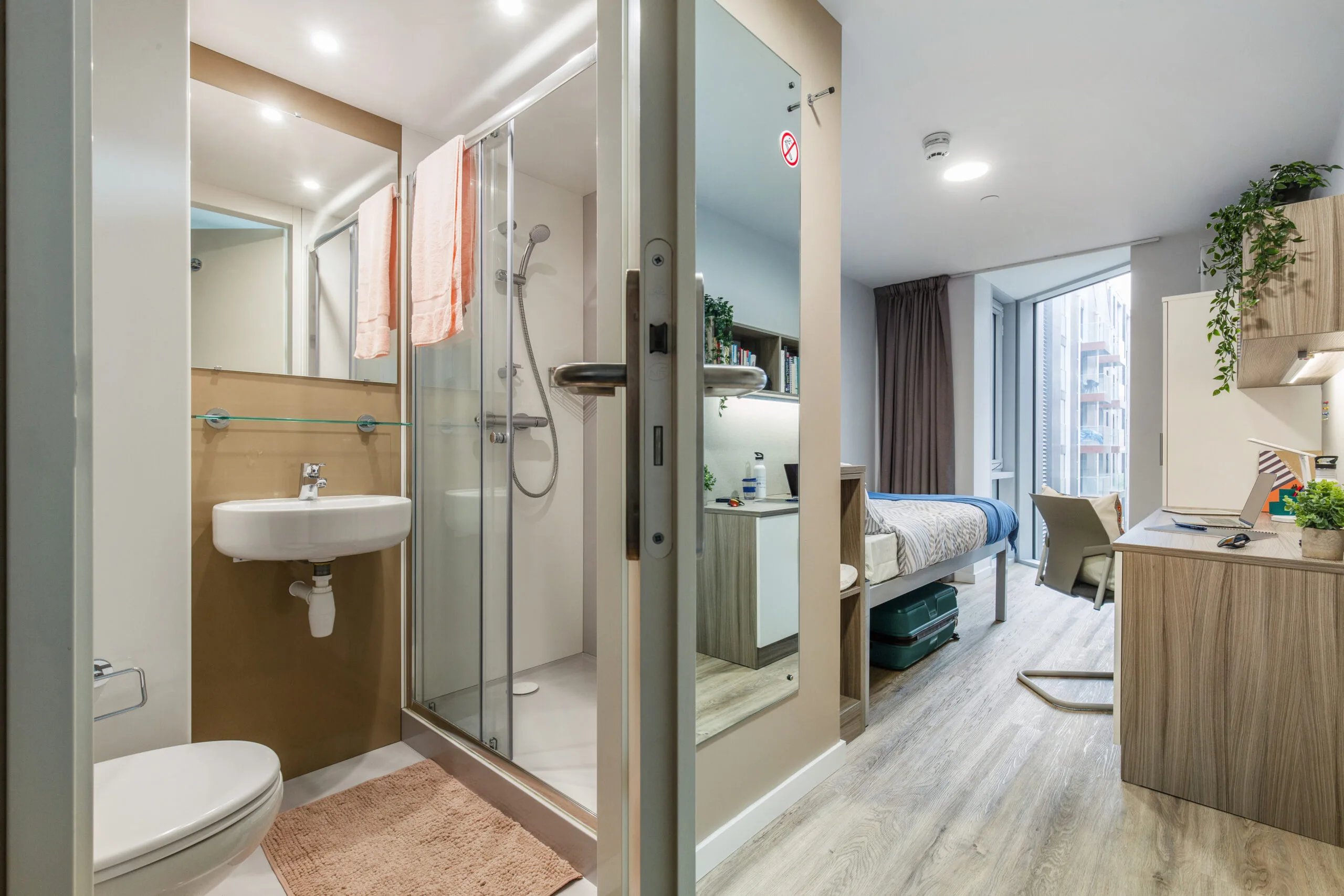 Toilet sink shower bed desk and chair bedroom at Kaplan Living Brighton in Brighton Student Accommodation
