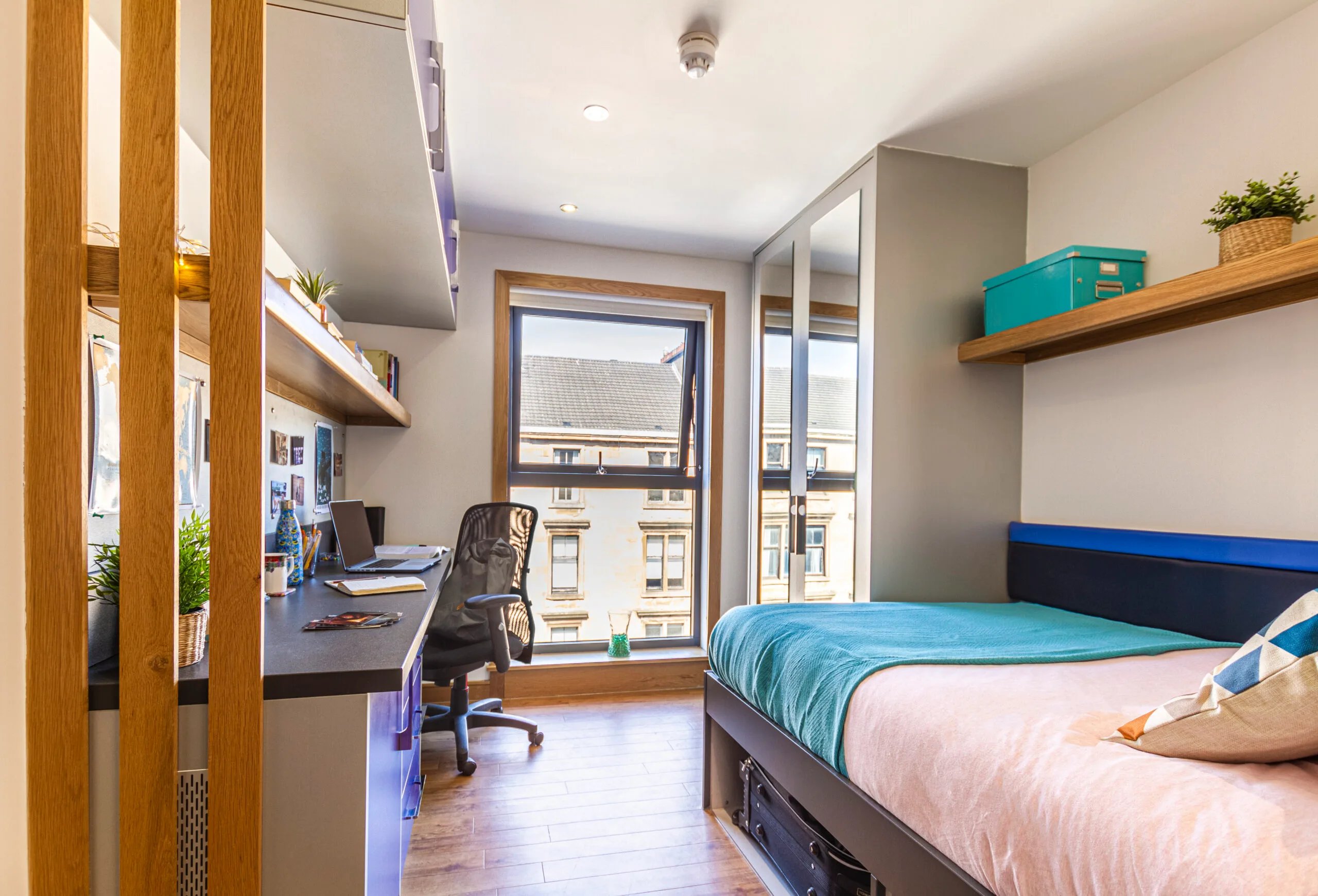 Bed desk chair window and shelves bedroom at Kaplan Living Glasgow - Argyle Street in Glasgow Student Accommodation
