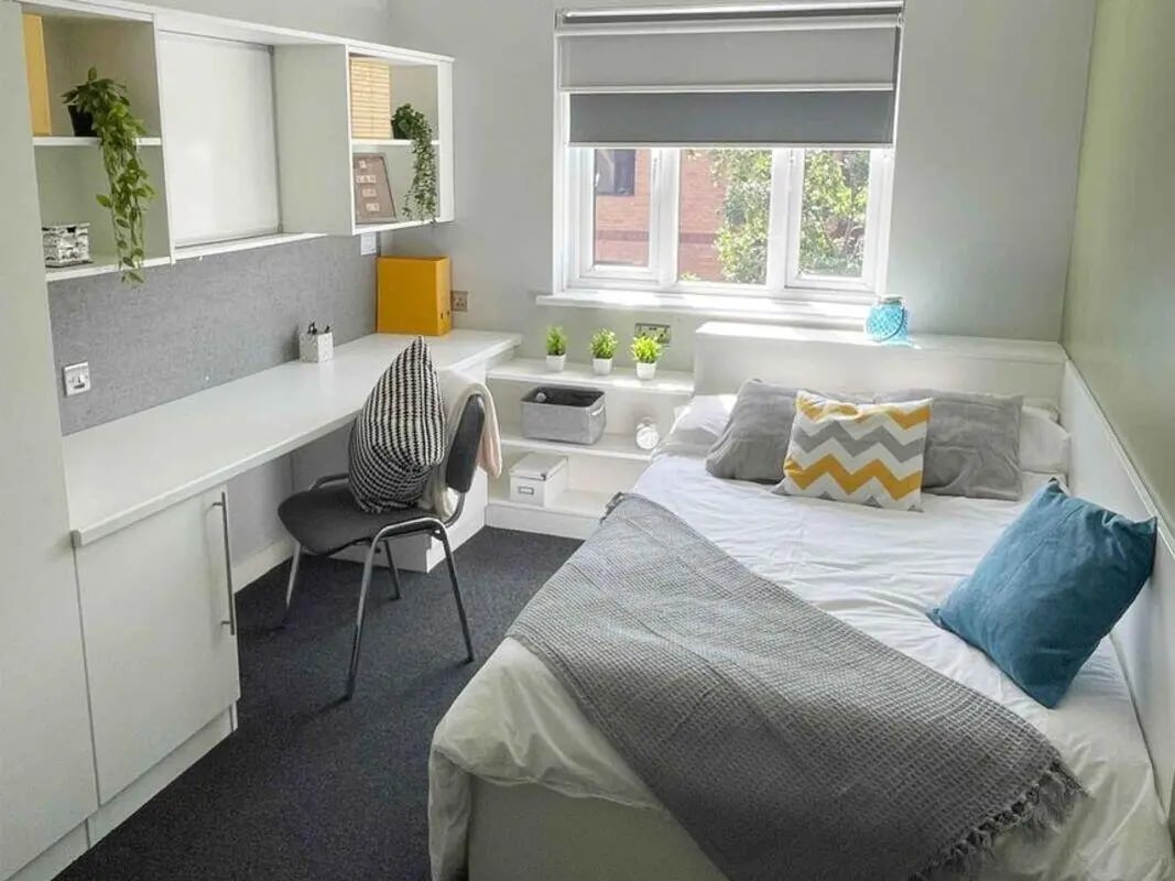 Desk bed shelves and chair bedroom at Singer Hall in Coventry Student Accommodation