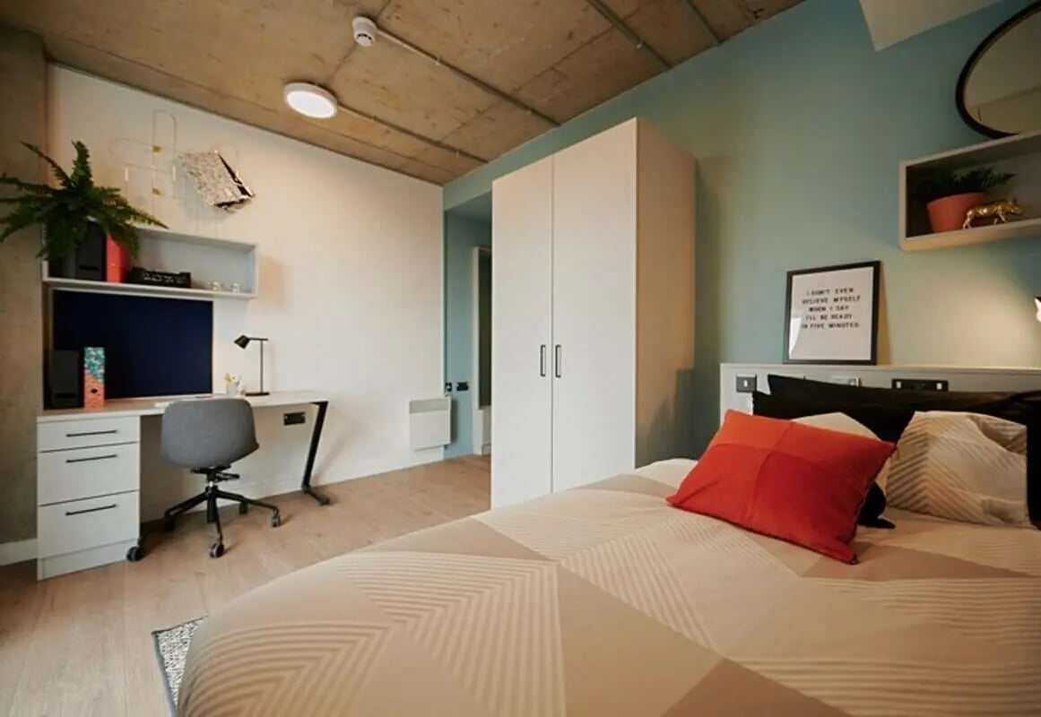 Bed desk wardrobe and bedding bedroom at The Loom in Dublin Student Accommodation