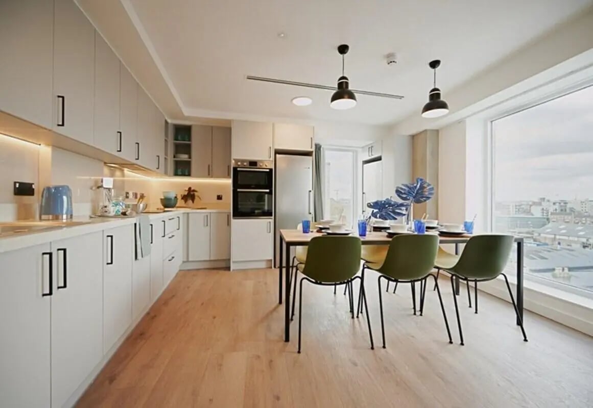 Modern kitchen with dining table and chairs kitchen at The Loom in Dublin Student Accommodation