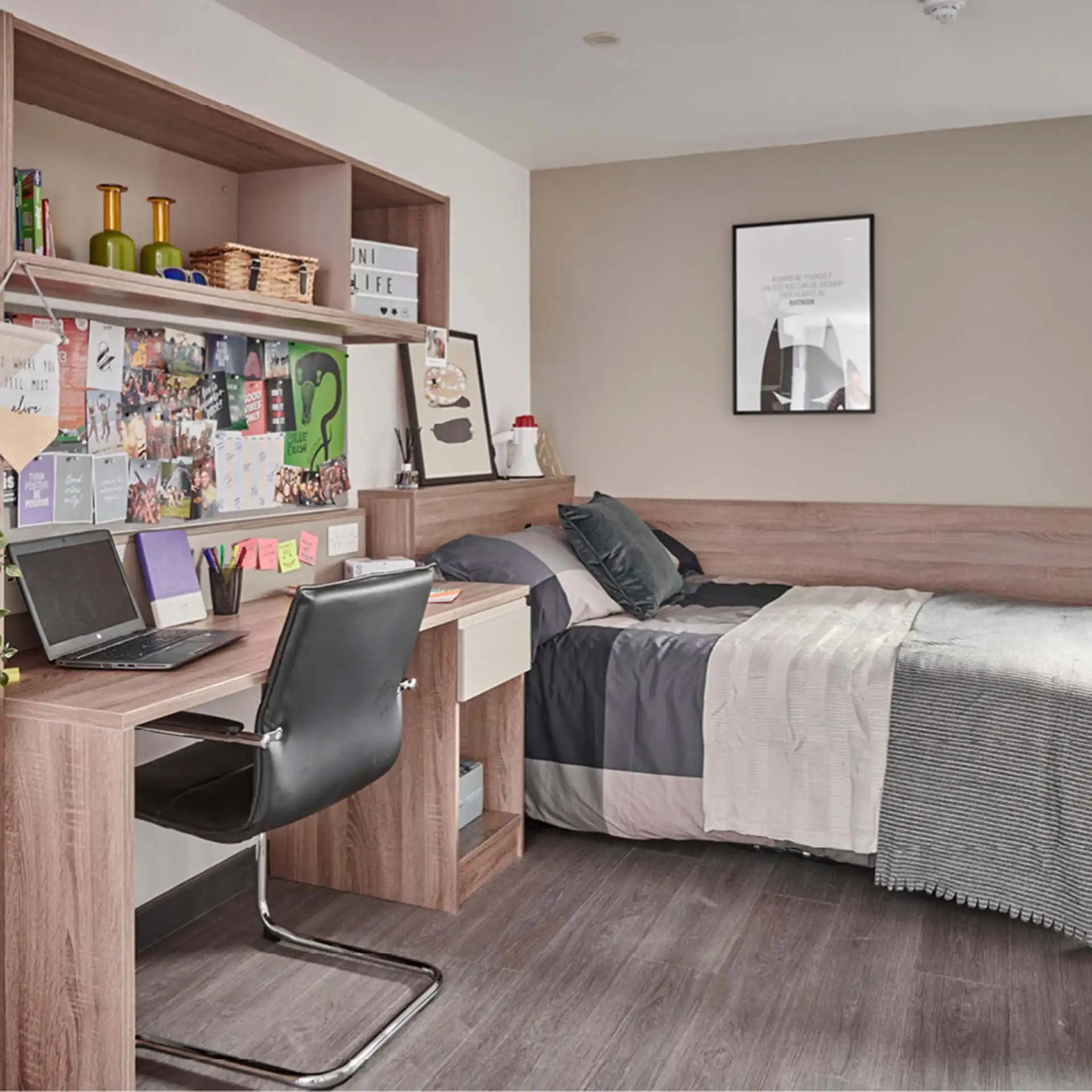 Desk bed pillows framed art and shelves bedroom at Trinity View Coventry in Coventry Student Accommodation