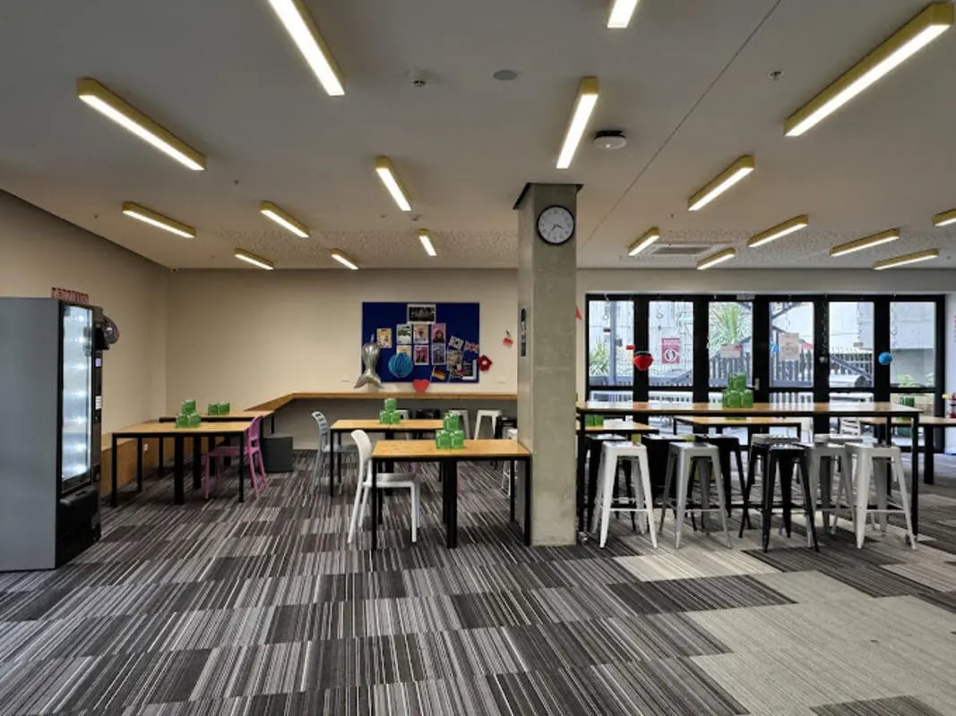 Tables chairs vending machine communal area at UniLodge Auckland City in Auckland Student Accommodation