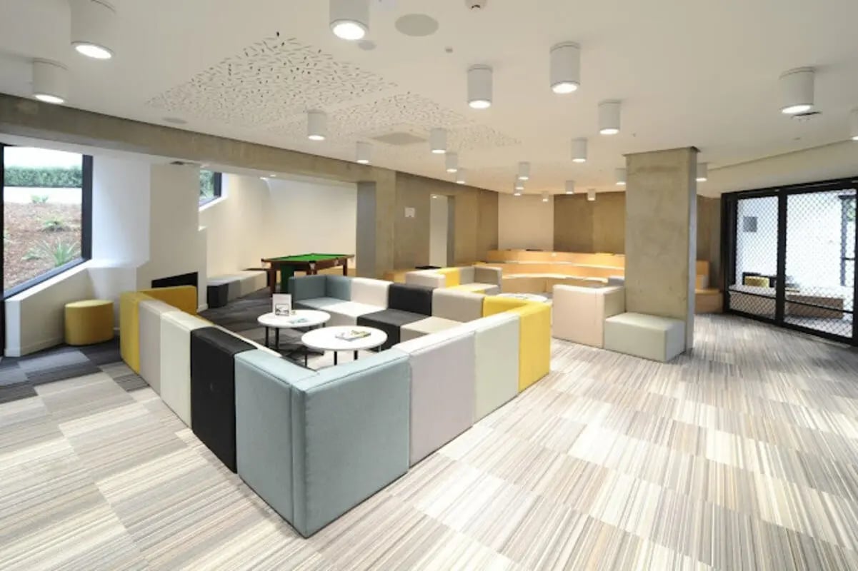 Modular sofas billiard table tiered seating common area at UniLodge Auckland City in Auckland Student Accommodation