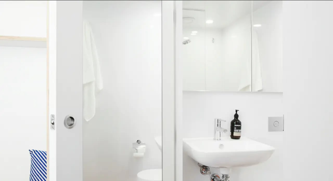 Sink towel toilet and shower bathroom at Scape Abercrombie in Sydney Student Accommodation