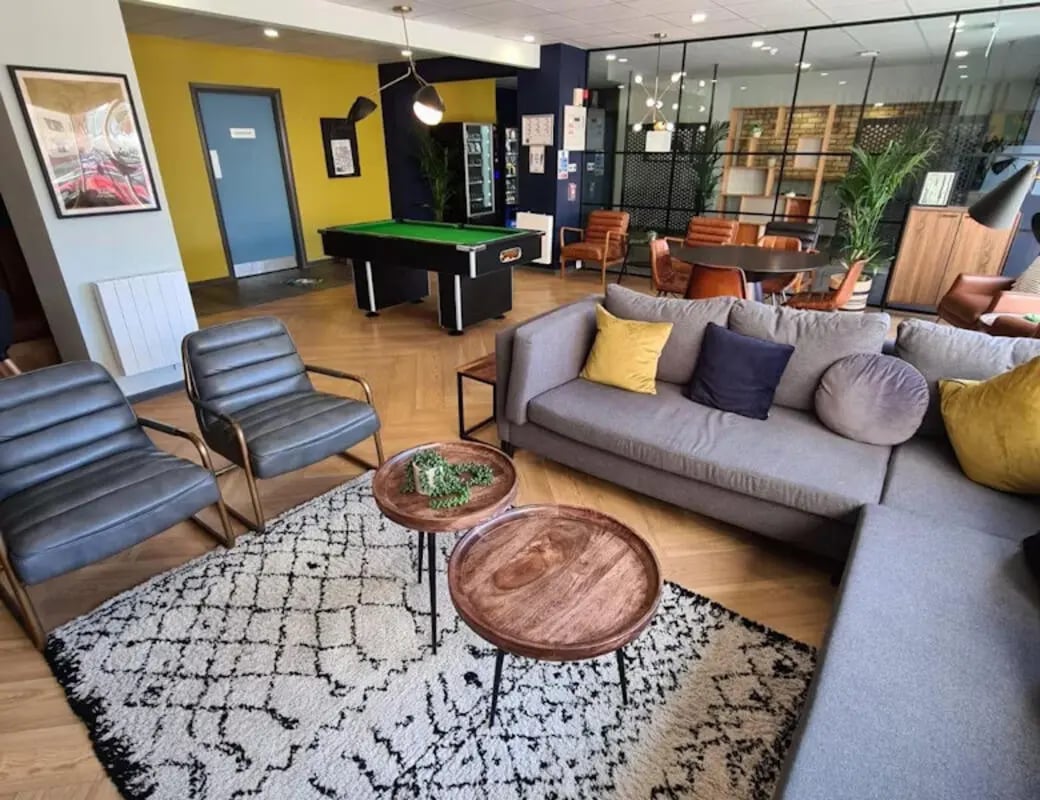 Sofa pool table chairs rug living area at Buchanan View in Glasgow Student Accommodation