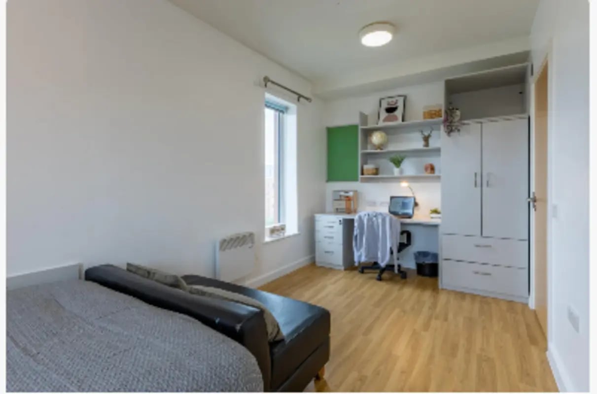 Bed desk wardrobe and shelves bedroom at The Maltings in Colchester Student Accommodation