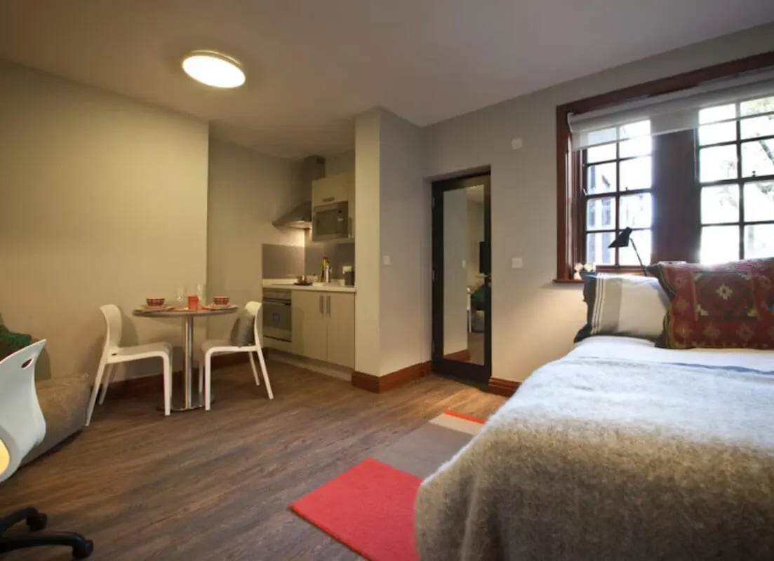 Studio apartment with kitchen dining and bedroom at Halsmere Studios in London Student Accommodation