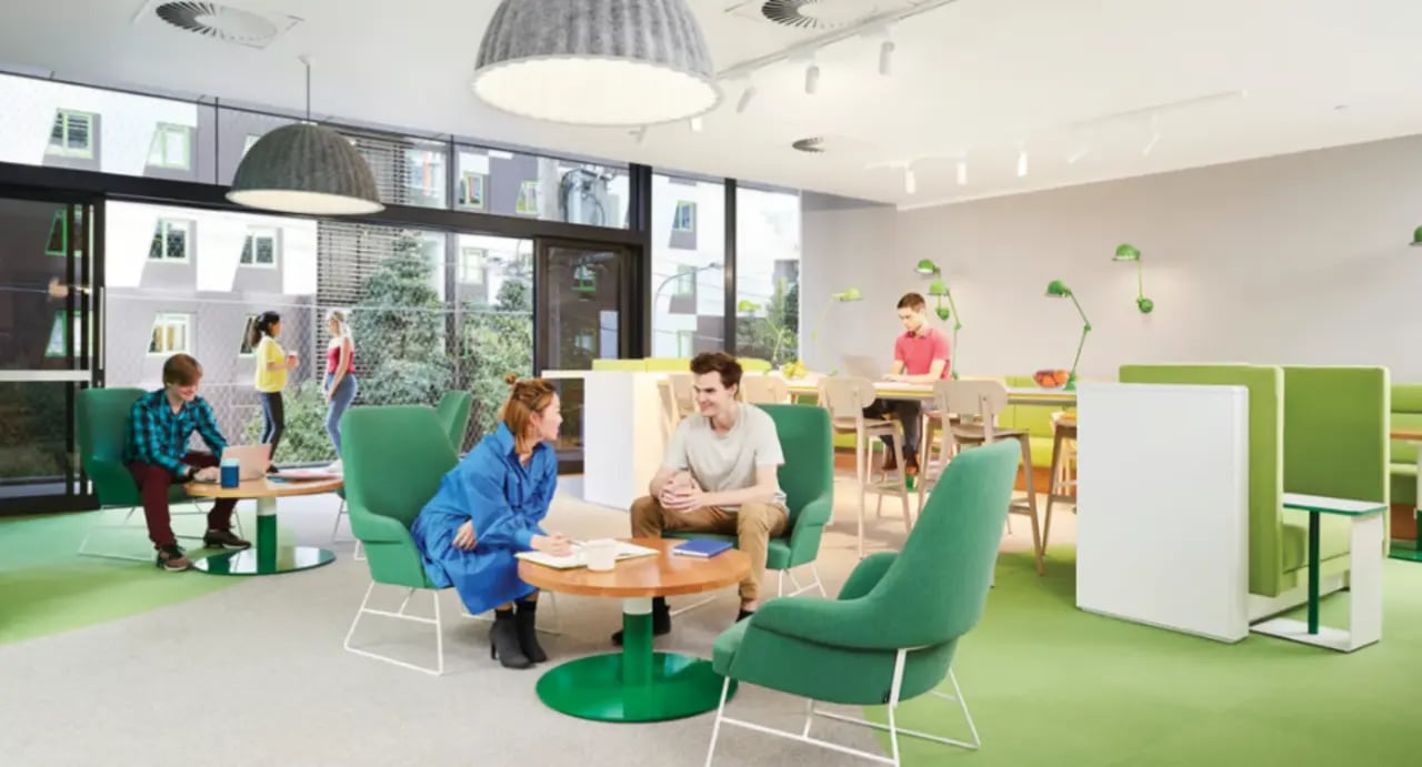 Modern lounge with green chairs and study desks lounge area at Scape South Bank in Brisbane Student Accommodation