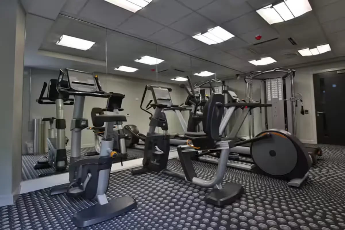 Exercise machines and large mirror gym at St Peter Studios in Aberdeen Student Accommodation