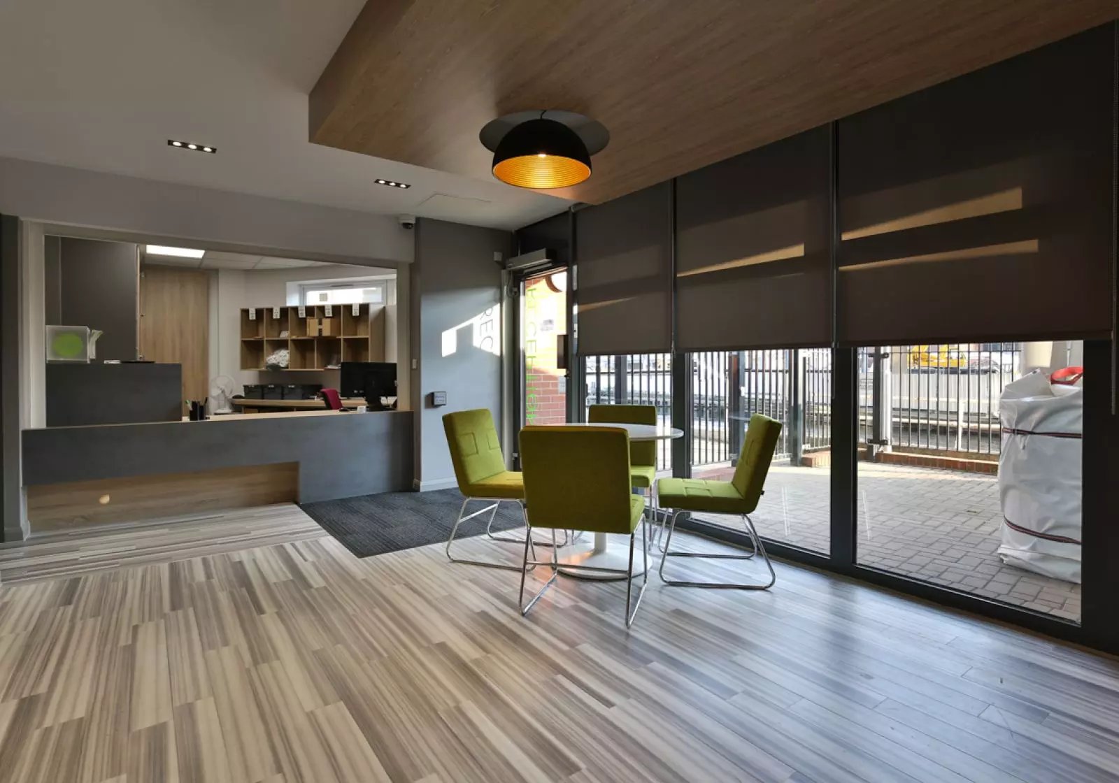 Reception desk with chairs and table common area at iQ Hayes Wharf in Lincoln Student Accommodation