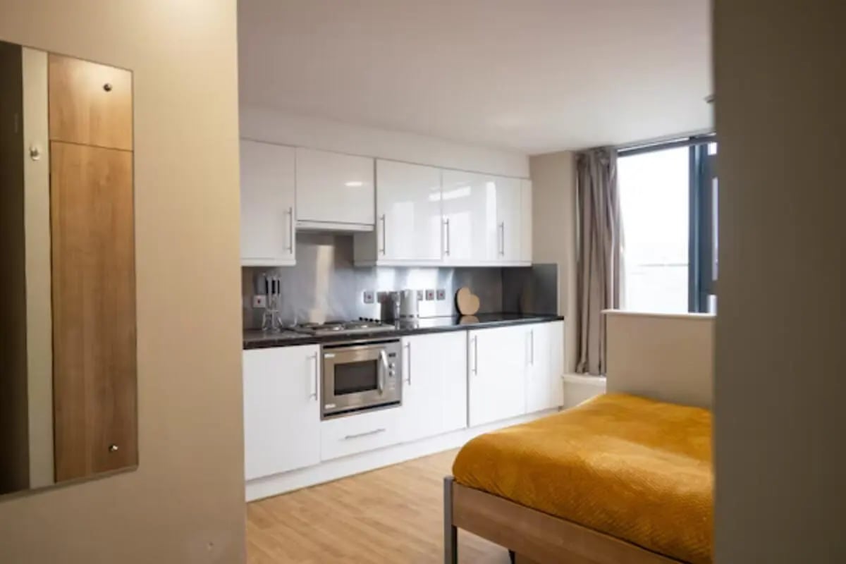 Modern studio apartment with kitchen and bed at Lady Nicolson Court in Edinburgh Student Accommodation