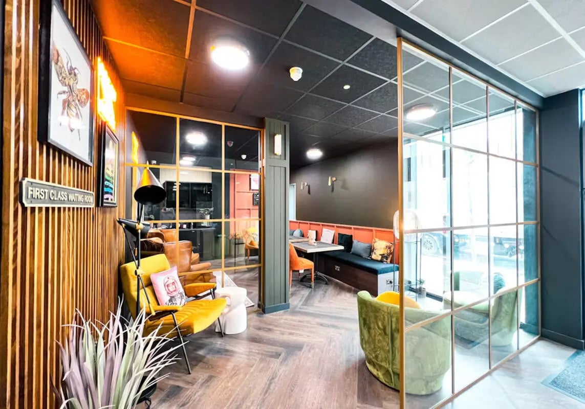 Yellow armchair leather seating modern communal area lounge at Lady Nicolson Court in Edinburgh Student Accommodation