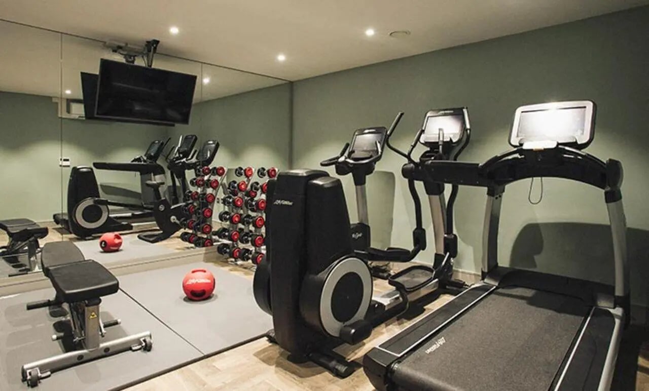 Elliptical treadmill bench weights mirror gym at Canvas The Parade in Cardiff Student Accommodation