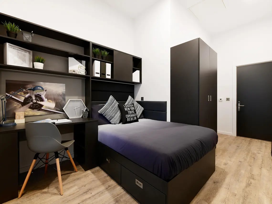 Desk bed wardrobe shelves and door bedroom at The Tannery in Dublin Student Accommodation